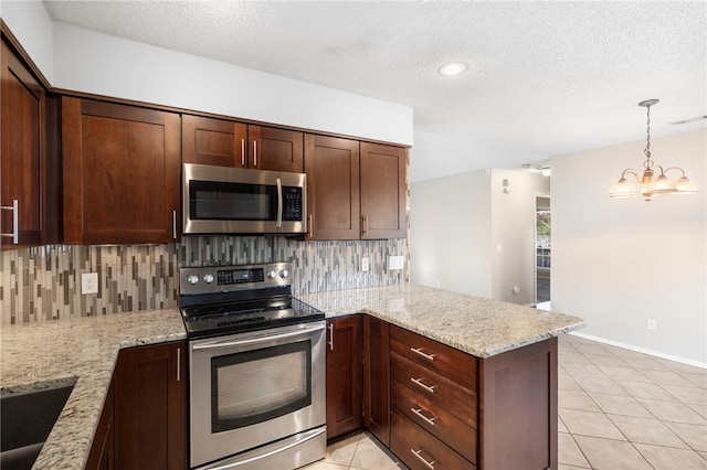 1600 N Stable Ave, Fayetteville, AR 72703 - kitchen with stainless steel appliances, a peninsula, a textured ceiling, and decorative backsplash