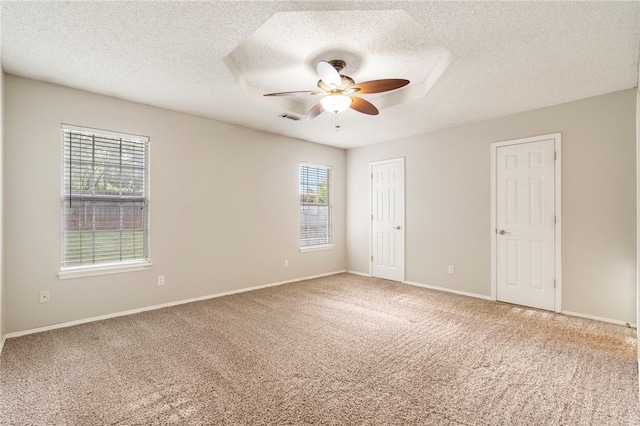 1600 N Stable Ave, Fayetteville, AR 72703 - carpeted empty room featuring a textured ceiling, visible vents, a ceiling fan, and baseboards