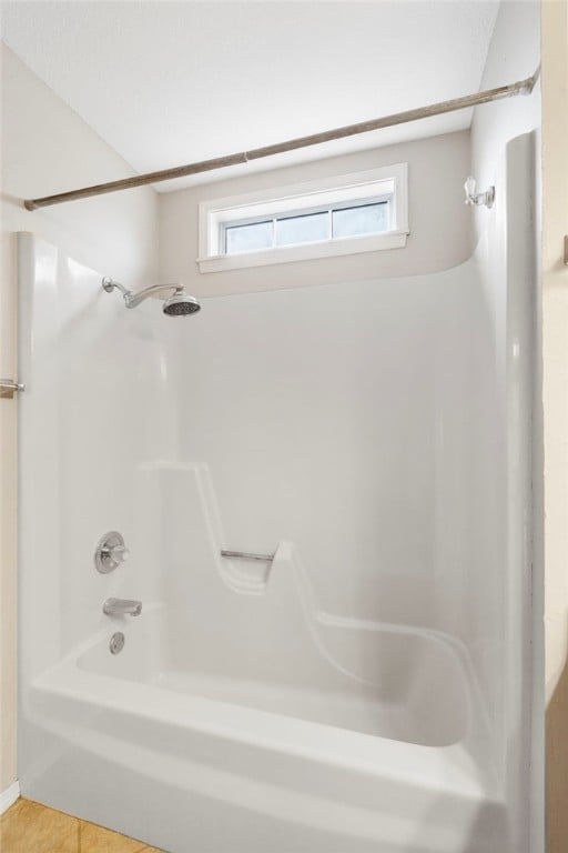 1600 N Stable Ave, Fayetteville, AR 72703 - full bathroom with tile patterned flooring, a healthy amount of sunlight, and shower / tub combination