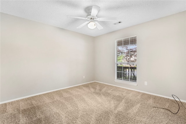 1600 N Stable Ave, Fayetteville, AR 72703 - unfurnished room featuring a textured ceiling, baseboards, a ceiling fan, and carpet floors