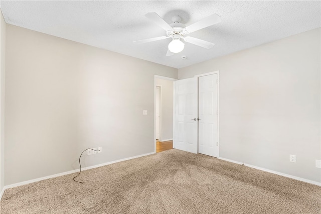 1600 N Stable Ave, Fayetteville, AR 72703 - interior space featuring a textured ceiling, a ceiling fan, carpet floors, and baseboards