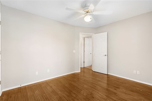 1600 N Stable Ave, Fayetteville, AR 72703 - unfurnished room featuring ceiling fan, wood finished floors, and baseboards