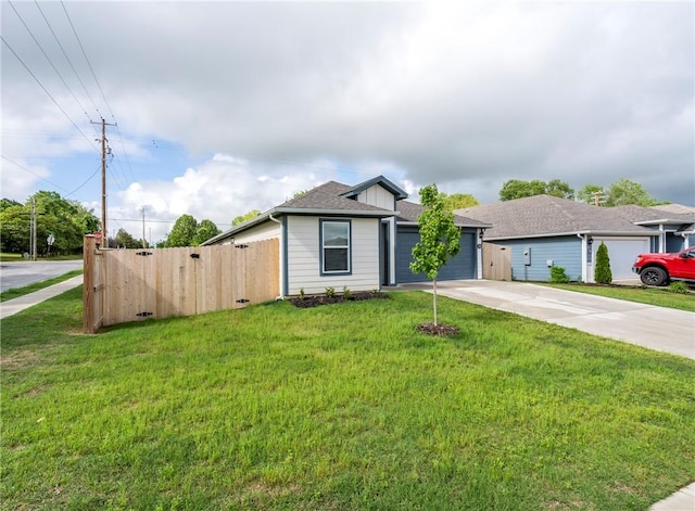 1300 Bates St, Gentry, AR 72734 - view of front facade with driveway, a garage, and a shingled roof