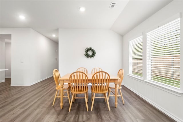 1300 Bates St, Gentry, AR 72734 - dining space featuring wood finished floors, baseboards, recessed lighting, and vaulted ceiling
