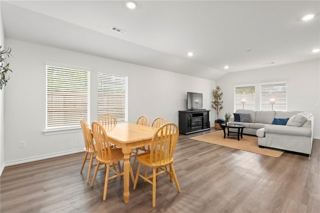 1300 Bates St, Gentry, AR 72734 - dining room with wood finished floors, healthy amount of natural light, recessed lighting, baseboards, and vaulted ceiling