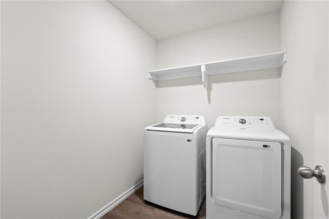1300 Bates St, Gentry, AR 72734 - washroom featuring washer and dryer, wood finished floors, and baseboards