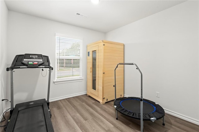 1300 Bates St, Gentry, AR 72734 - workout area with wood finished floors and baseboards