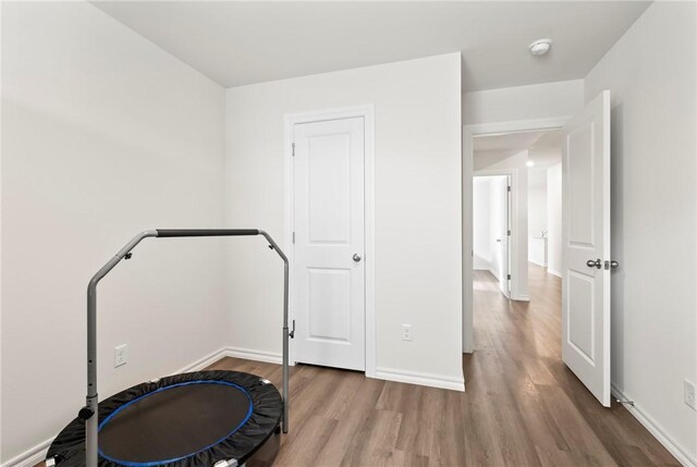 1300 Bates St, Gentry, AR 72734 - workout area featuring wood finished floors and baseboards
