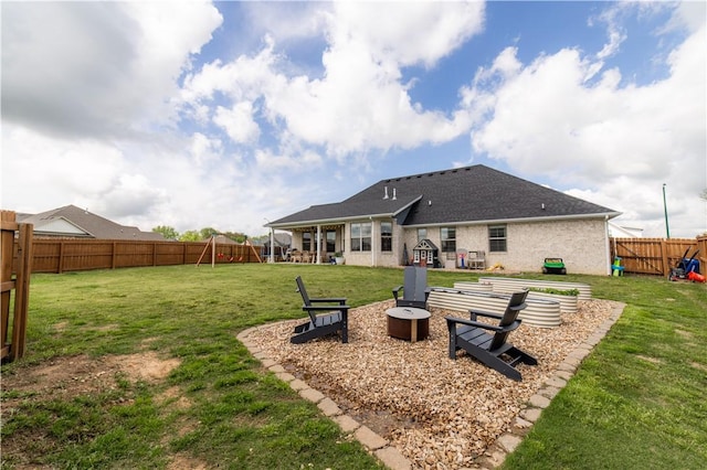 back of property with a lawn and a fenced backyard
