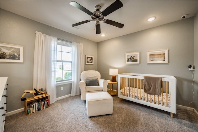 carpeted bedroom with recessed lighting, a ceiling fan, a nursery area, and baseboards