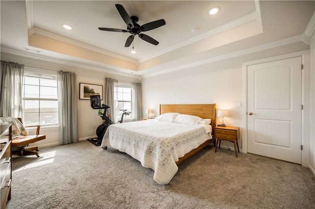 carpeted bedroom with recessed lighting, crown molding, and a tray ceiling