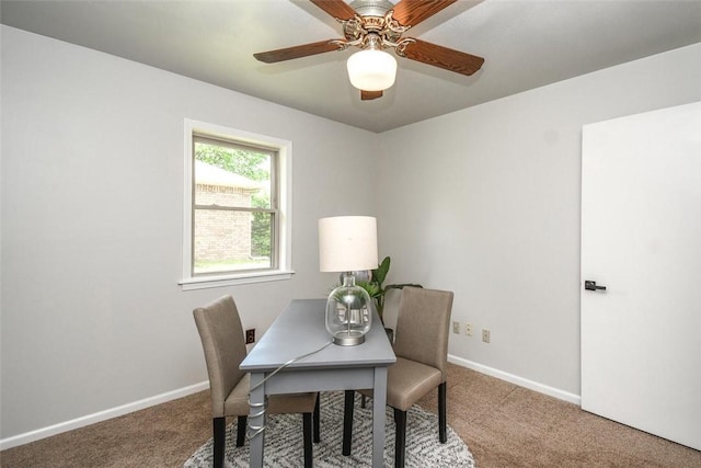 office space with baseboards, a ceiling fan, and carpet floors