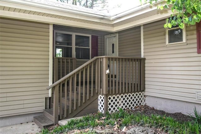 property entrance with a deck