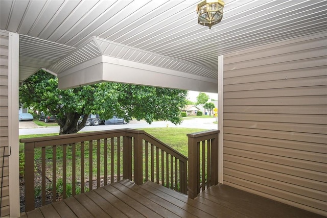 wooden deck with a yard