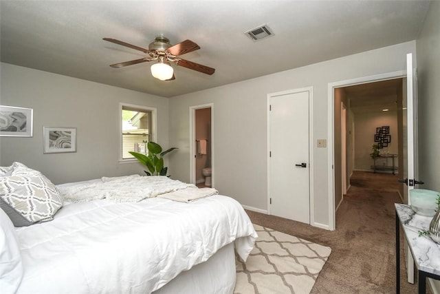bedroom featuring connected bathroom, a ceiling fan, visible vents, baseboards, and light colored carpet