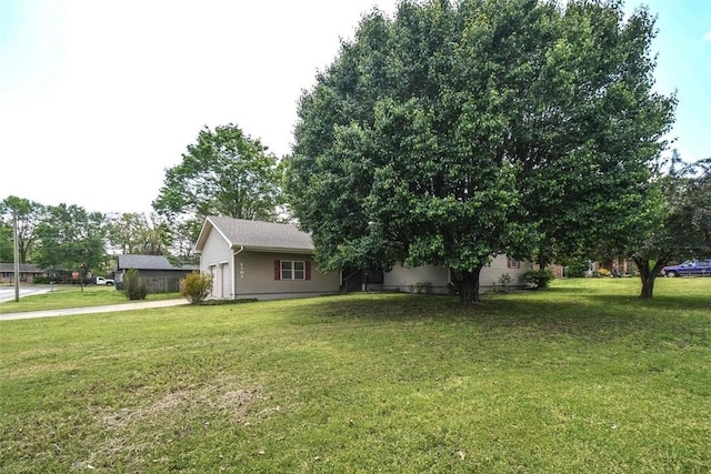 exterior space with driveway and an attached garage