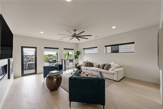 424 SE D St, Bentonville, AR 72712 - living area with light wood-type flooring, recessed lighting, ceiling fan, and baseboards