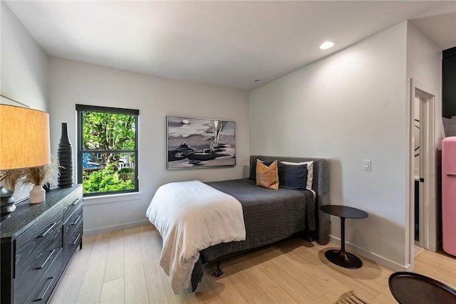 424 SE D St, Bentonville, AR 72712 - bedroom featuring recessed lighting, baseboards, and light wood-type flooring