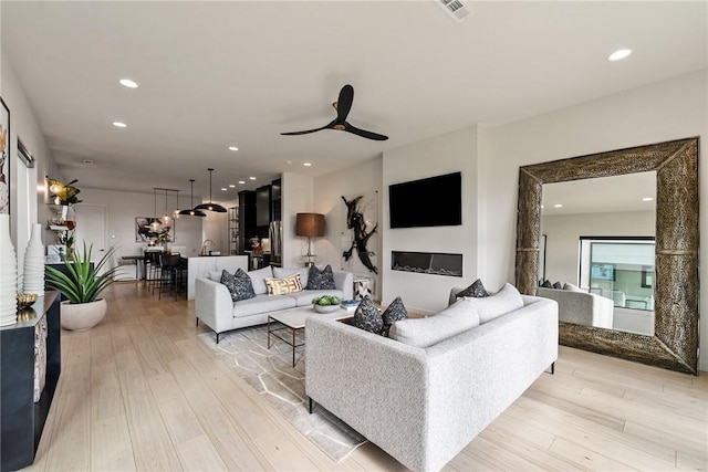 424 SE D St, Bentonville, AR 72712 - living area featuring visible vents, a ceiling fan, light wood-type flooring, and recessed lighting