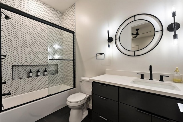 424 SE D St, Bentonville, AR 72712 - full bathroom featuring toilet, tile patterned flooring, bath / shower combo with glass door, and vanity