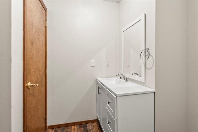 1622 2nd St, Westville, OK 74965 - bathroom featuring baseboards, wood finished floors, and vanity