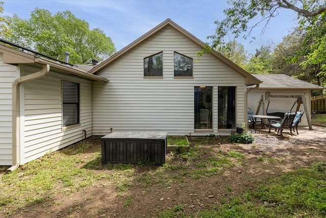back of house with a patio area