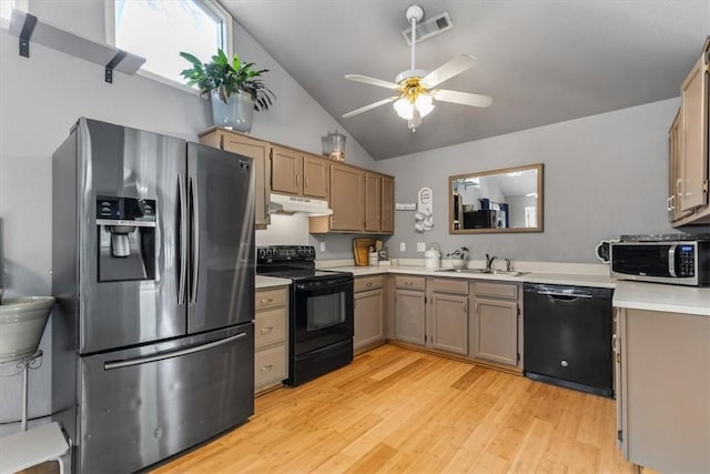 kitchen with under cabinet range hood, light wood-style floors, black appliances, visible vents, and vaulted ceiling