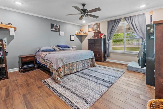 bedroom with baseboards, recessed lighting, wood finished floors, and crown molding