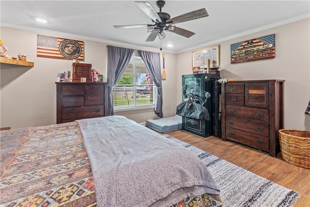 bedroom with recessed lighting, wood finished floors, and crown molding