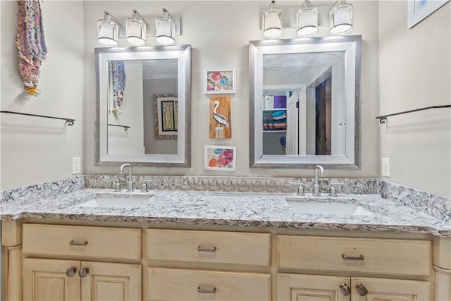 full bath with double vanity and a sink