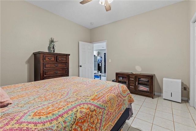 bedroom with light tile patterned flooring, a ceiling fan, and baseboards