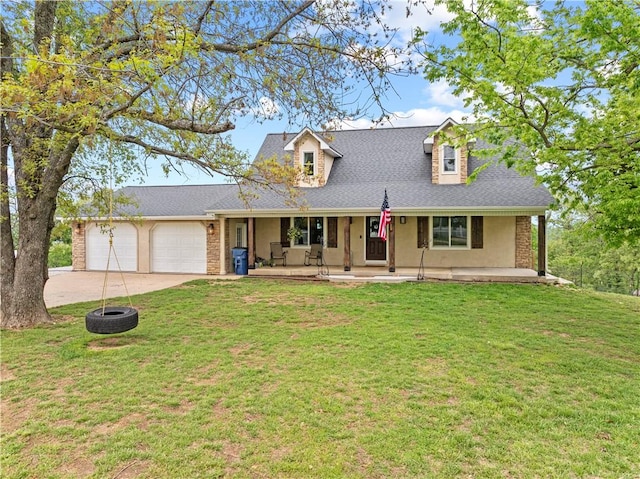 view of front of house featuring a porch, a front yard, driveway, and a garage