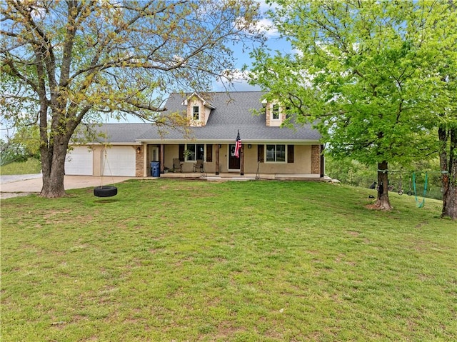 view of front of home featuring a garage, covered porch, a front lawn, and concrete driveway