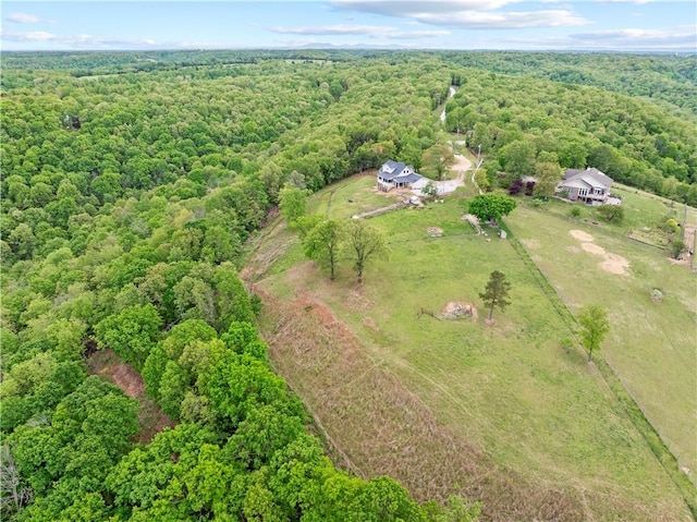 birds eye view of property featuring a rural view and a view of trees
