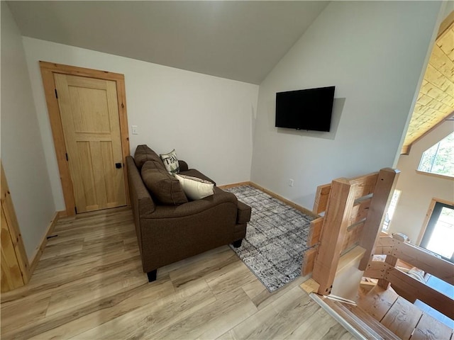 794 NC-3986, Jasper, AR 72641 - living room featuring light wood finished floors, high vaulted ceiling, and baseboards