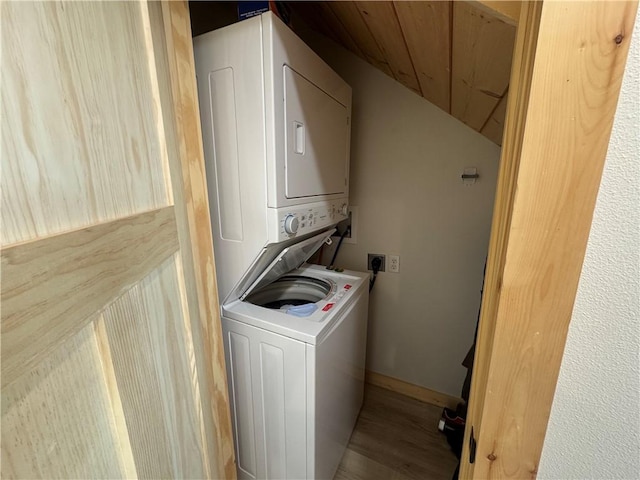 794 NC-3986, Jasper, AR 72641 - clothes washing area with stacked washer and clothes dryer and wood finished floors