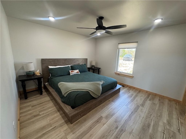 794 NC-3986, Jasper, AR 72641 - bedroom with ceiling fan, baseboards, and light wood-style floors