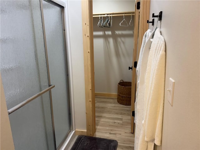 794 NC-3986, Jasper, AR 72641 - full bath with a shower stall, wood finished floors, and baseboards