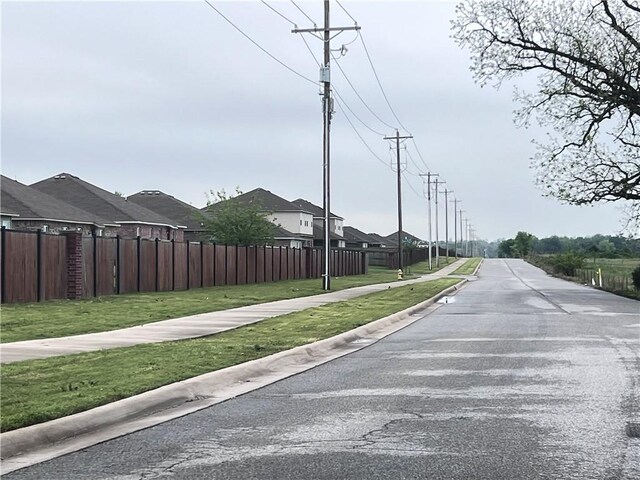 view of street featuring sidewalks and curbs