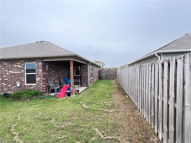 view of yard featuring a patio and a fenced backyard