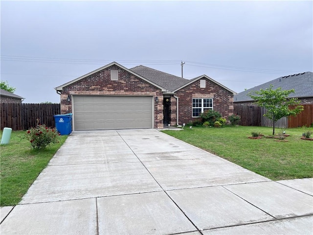 ranch-style home featuring brick siding, fence, a garage, a front yard, and concrete driveway