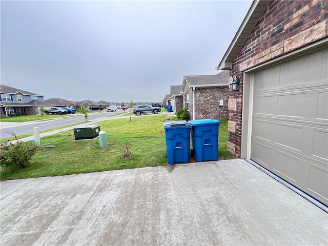 exterior space with a residential view and a garage