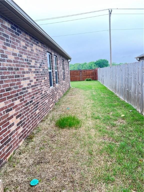 view of yard featuring a fenced backyard