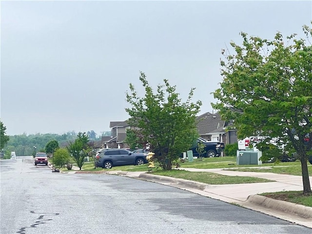 view of road with curbs and sidewalks