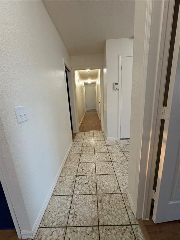 8455 Par Ln, Rogers, AR 72756 - hallway featuring light tile patterned flooring and baseboards