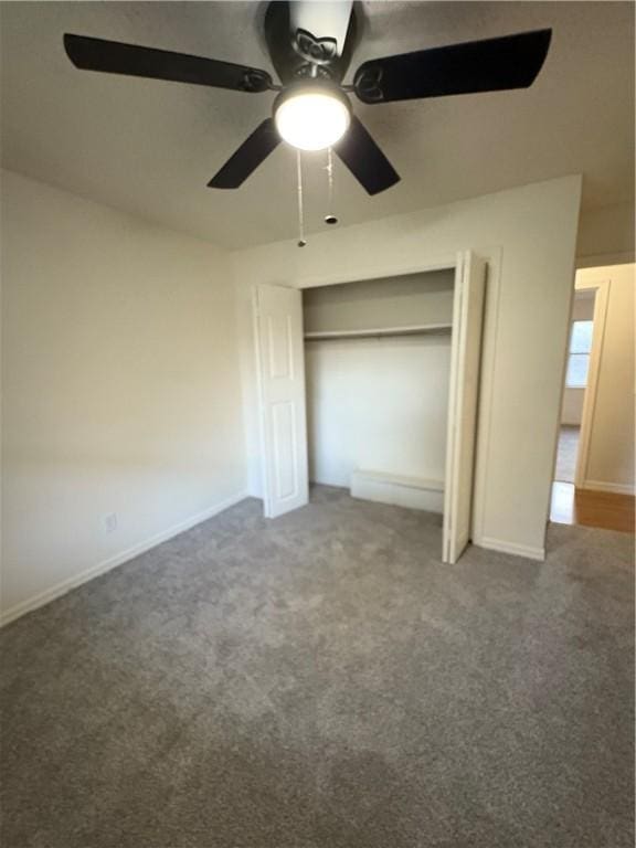 8455 Par Ln, Rogers, AR 72756 - unfurnished bedroom featuring carpet flooring, ceiling fan, a closet, and baseboards