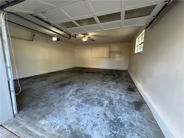8455 Par Ln, Rogers, AR 72756 - garage featuring a garage door opener and baseboards