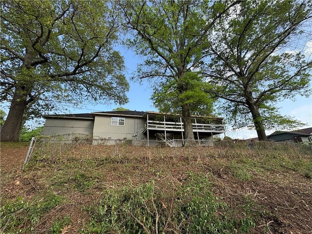 8455 Par Ln, Rogers, AR 72756 - rear view of house featuring a wooden deck