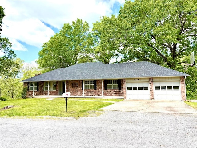 8455 Par Ln, Rogers, AR 72756 - ranch-style house with a garage, concrete driveway, a front lawn, and a shingled roof