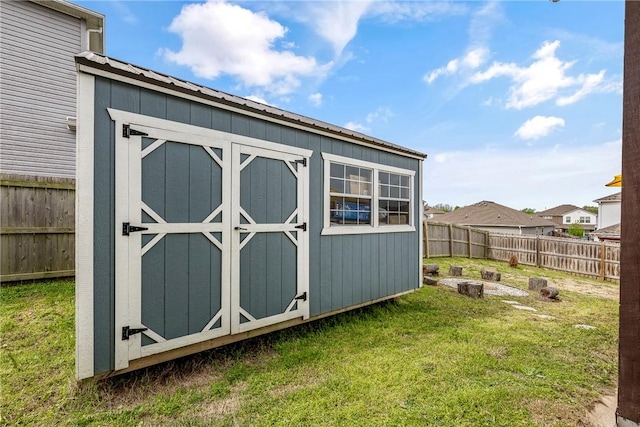 view of shed featuring a fenced backyard